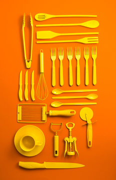 Well organised yellow kitchen objects on orange background.