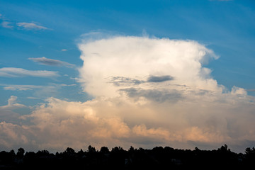 Storm cumulonimbus cloud on blue sky