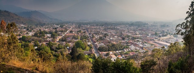 Aerial view of Antigua, Guatemala. Volcano Agua in the background.