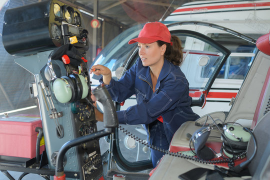 female helicopter mechanic at work