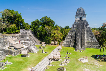 TIKAL, GUATEMALA - MARCH 14, 2016: Tourists at the Gran Plaza at the archaeological site Tikal,...