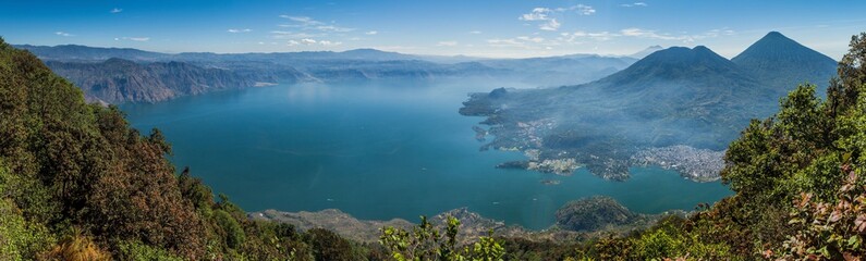 Fototapeta premium Atitlan lake in Guatemala, picture taken from San Pedro volcano. Volcanoes Cerro de Oro, Toliman, Atitlan at the right side.