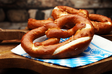 Pretzels on wooden board on rustic background. german food.