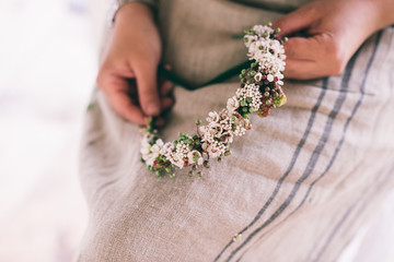 Woman makin a flower wreath