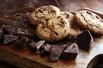 Chocolate cookies on wooden table. Chocolate chip cookies shot