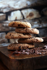 Chocolate cookies on wooden table. Chocolate chip cookies shot