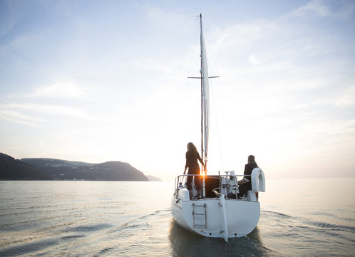 Couple sailing together.
