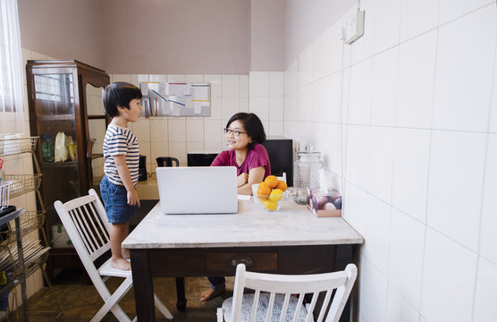 Son sharing stories with mom