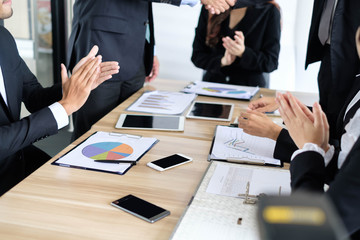 Asian business people meeting time, colleagues clapping their hands congrats to their manager join with new partner at finish meeting, business colleagues teamwork concept