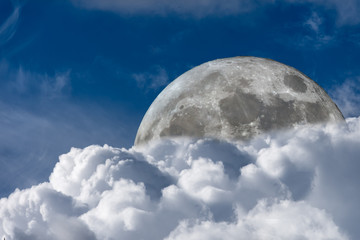 Moon Rising Behind An Atmospheric Cloud Cluster