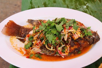 Fried snapper spicy mix vegetable is delicious