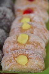 A lot of donut and strawberry jam