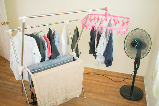 hanging washed clothes in room