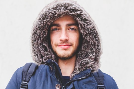 Young Man with Furred Hood during the Cold Season