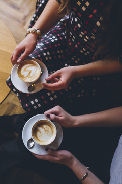 Two Female Friends Drinking Coffee