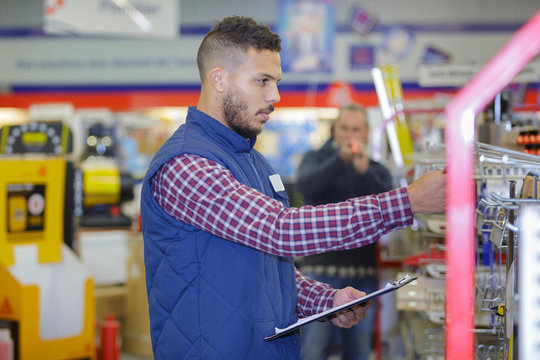 worker inspecting the product in the shop