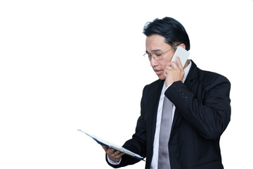 Middle-aged asian business man using smartphone contact with partner while standing and looking chart about finance data isolated white back,ground,business people concept