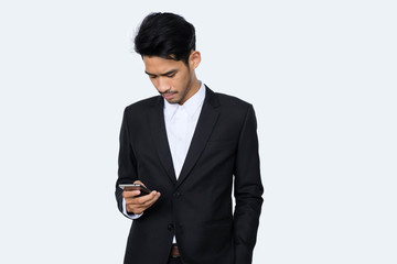 Young handsome asian business man using smartphone contact with partner while standing isolated white background,business people concept