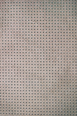 White beige velvet perforated leather texture background