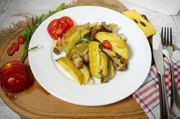 Homemade dish of potatoes. Baked potatoes and vegetables.