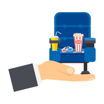 hand with blue cinema seat