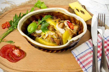 Potatoes baked in a clay pot. Homemade dish.