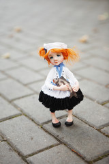 Cute dolls hand-made on a walk in an autumn Park