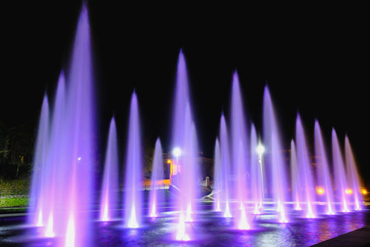 colored water fountain at night