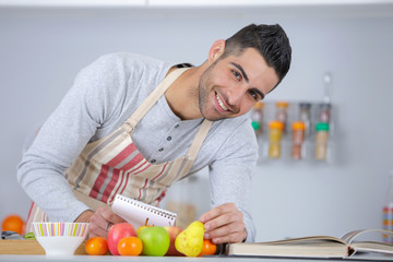 handsome man cooking at home