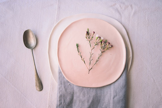 Branch in bloom on a handmade ceramic plate