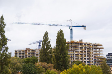 Building construction with crane in the city
