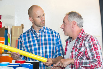 two construction workers at building site