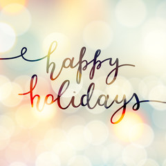 happy holidays lettering, vector handwritten text on blurred background of lights
