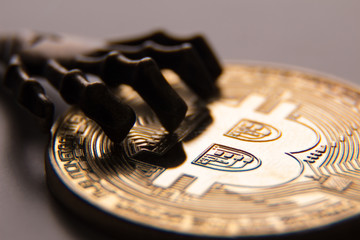 Close-up of pirate fingers on bitcoin.