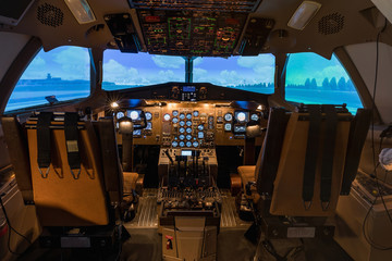 A view of the cockpit of a large commercial airplane, a cockpit trainer.