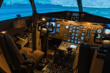A view of the cockpit of a large commercial airplane, a cockpit trainer.