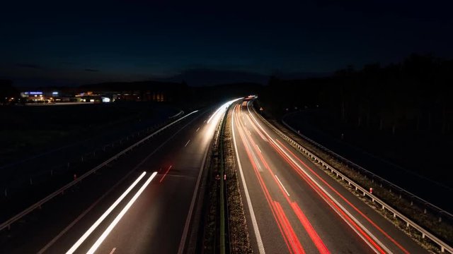 car lights at rush hour on an motorway junction, traffic timelapse