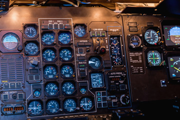A view of the cockpit of a large commercial airplane, a cockpit trainer. Control panel in a plane cockpit