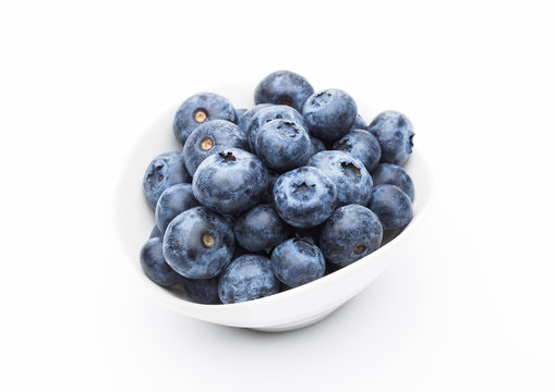 Fresh healthy organic blueberry in white bowl