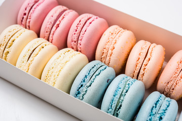 Colorful assorted macaroon cookies in a gift box