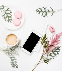 Social media flat lay with coffee, flowers and smartphone