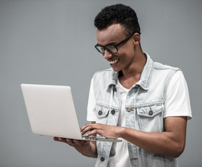 Afro American guy with gadget