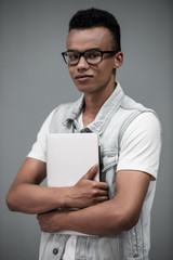 Afro American guy with gadget