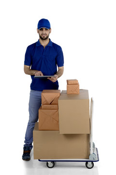 Italian courier using a digital tablet on studio