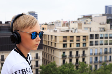 Young boy visit La Pedrera with audioguide. Additional education.
