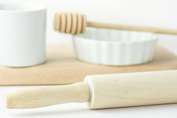 Wooden Rolling Pin Honey Dipper White Baking Form Measuring Cup on Table Pastry Holiday Cooking Bakery Concept Clean Minimalist Template for Poster Banner Copy Space Toned