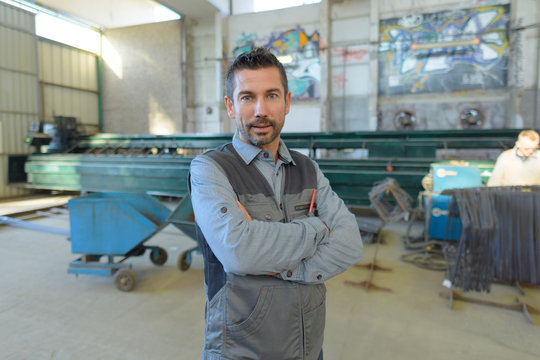 smith posing in the factory