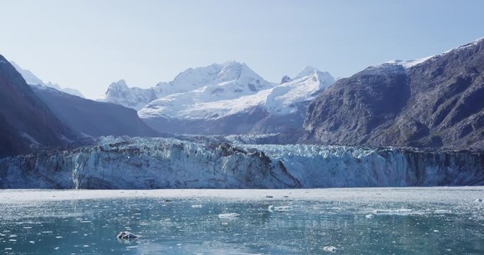 Global warming and climate change concept with melting glacier. Alaska Glacier Bay landscape with Johns Hopkins Glacier and Mount Fairweather Range mountains in amazing Glacier Bay landscape, Alaska
