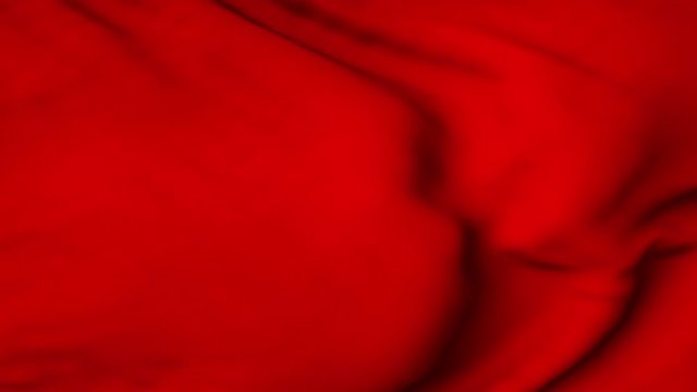 A red flag waving in the wind. The flag flaps in the breeze, filling the whole frame. See portfolio for similar and much more!