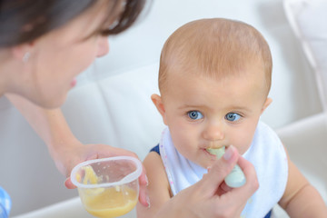 giving food to a baby